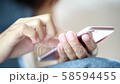 Female hand holding a play phone. On-line business ideas and technology 58594455