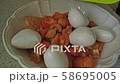 Chopped tomatoes in a white bowl with bread. Preparing italian salad Panzanella with bread, tomato. 58695005
