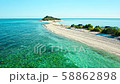 Aerial view of a tropical island in the middle of the ocean. 58862898
