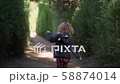 Little girl running outdoors slow motion 58874014