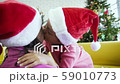 Asian girl kissing her mother and hugging 59010773
