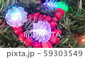 Decorated Christmas tree with bright red coral necklace. 59303549