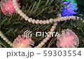 Decorated Christmas tree with pearl necklace. 59303554