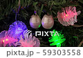 Beautiful pearl earrings hanging on Christmas tree. 59303558