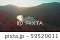Levee drone aerial flying at sunrise with hills and mountains in Hungary 59520611