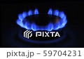 The appearance of a blue flame of gas. Gas stove on a black 59704231