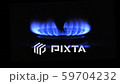 The appearance of a blue flame of gas. Gas stove on a black 59704232