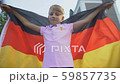 Patriot young boy waving German flag, celebrating 59857735