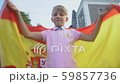 Spanish football fan waving national flag 59857736
