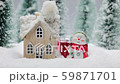 Snowman and house in winter 59871701