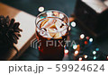 Mulled wine in glass on black wooden table in awesome background lights 59924624