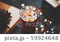Mulled wine in glass on black wooden table in awesome background lights. Vintage colour tones 59924648