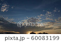 Cloudy tropical sunrise with black cloud passing by 60083199