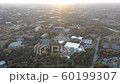 Aerial 4k footage of Atlanta suburbs showing houses and local business during sunset with sun rays in the Fall Season 60199307
