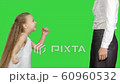 Happy mother giving high five to her little daughter on a Green Screen, Chroma Key 60960532