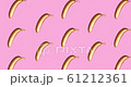 Background of golden metallic banana on a pink. A modern creative concept. Contemporary art  61212361