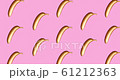 Background of golden metallic banana on a pink. A modern creative concept. Contemporary art  61212363