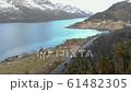 beautiful view of road with cars near lake with mountains 61482305