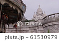 View of Montmartre and the Sacre Coeur Basilica, with a carousel in the foreground. Paris, France 61530979