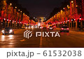 Beautiful evening in Paris, Champs Elysees decorated for Christmas, traffic near Arc de Triomphe 61532038
