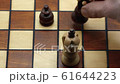 Checkmate With Pawn And Queen On A Wooden Chess Board, Slow Motion 61644223
