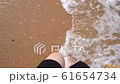 Top view of woman stepping at the sand at sea beach 61654734
