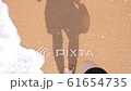 Top view of woman stepping at the sand at sea beach 61654735