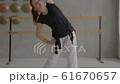 Girl does sports exercises in the hall 61670657