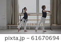 Trainer and student in a dance training session in the hall general plan 61670694