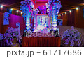 altar with Hindu God decorated with flowers in festal hall half Kumbha Mela 61717686