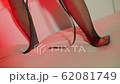 Legs of a girl make dance moves at a party in a 62081749