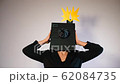 Man with his head holding a camera. 62084735