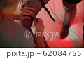 Closeup of fastening straps on a dominatrix woman 62084755