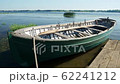 An old fishing boat is moored on a summer day 62241212