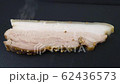 frying pork belly slices closeup 4k 62436573