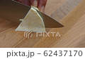 cutting celery into slices on a cutting board with a kitchen knife closeup 4k 62437170