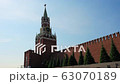 Clock on Spasskaya Tower of the Kremlin against the blue sky on a sunny summer day. Red Square in 63070189