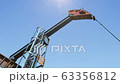 Low angle shot of oil pump jack pumping crude oil under clear blue sunny sky 63356812