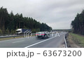 Heavy traffic on the freeway. Road goes beyond the horizon Pine forest TimeLapse 63673200