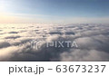 View from the airplane window on the blue sky and white clouds. Travel concept 63673237