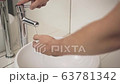To prevent coronavirus pandemic, wash your hands with warm water and soap. 4K 63781342