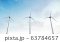 Wind turbine generators. Wide angle view of three turbine generators in operation with cloudy sky in background. Concept of environment friendly technology. 63784657
