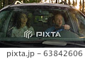 Married caucasian couple on road trip, people traveling by car on the street 63842606