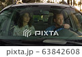 Unhappy sad couple sitting in car not talking driving 63842608