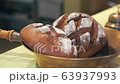 View of the Russian brown (black) bread in the bowl. Restaurant style business. Close up cakes 63937993