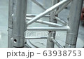 The podium for the stage. Installation of metal construction Score with a hammer 63938753