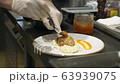 Mashed potatoes with cutlet and red caviar. Cooking chef in the restaurant 63939075