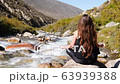 Back View Of Woman Practicing Meditation Doing Yoga By Rapid Rivers Yoga, Zen Buddhism, Healthy 63939388