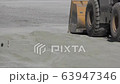 Tractor loader picking up soil in a large bucket during the construction of the road, background, industry, FullHD, multifunctional 63947346