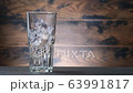Pouring cola in glass with ice cubes. Soda with ice and bubbles. Slow motion footage sweet drink 63991817